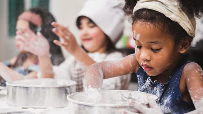 Preschoolers learning to cook